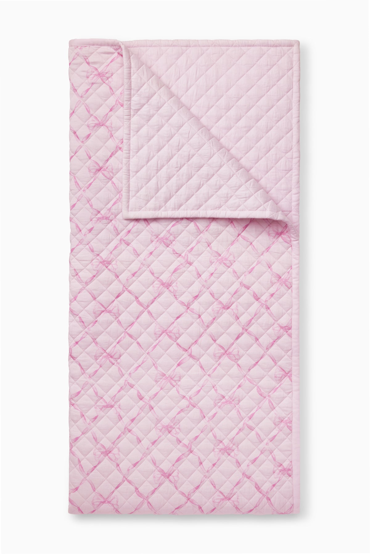 Pink sweetheart quilt with quilted diamond pattern and stitched border