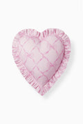 Pink heart pillow with ruffled border and bow-patterned heart front