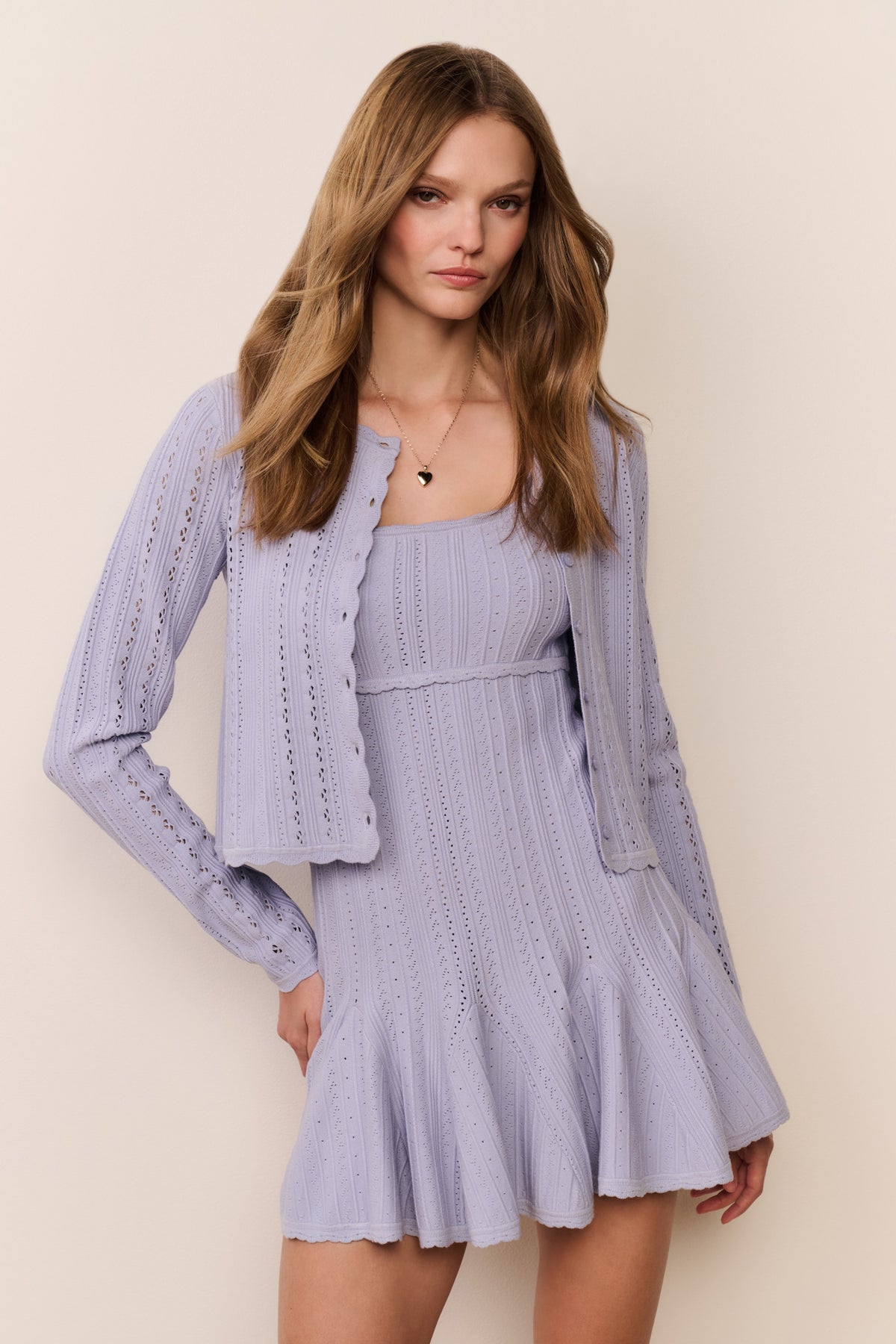 Light lavender pointelle knit cardigan over matching dress, front view