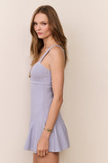 Lavender pointelle mini dress with thin straps and flared skirt, side profile