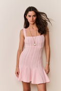 Pink pointelle mini dress with thin straps and flared skirt, front view