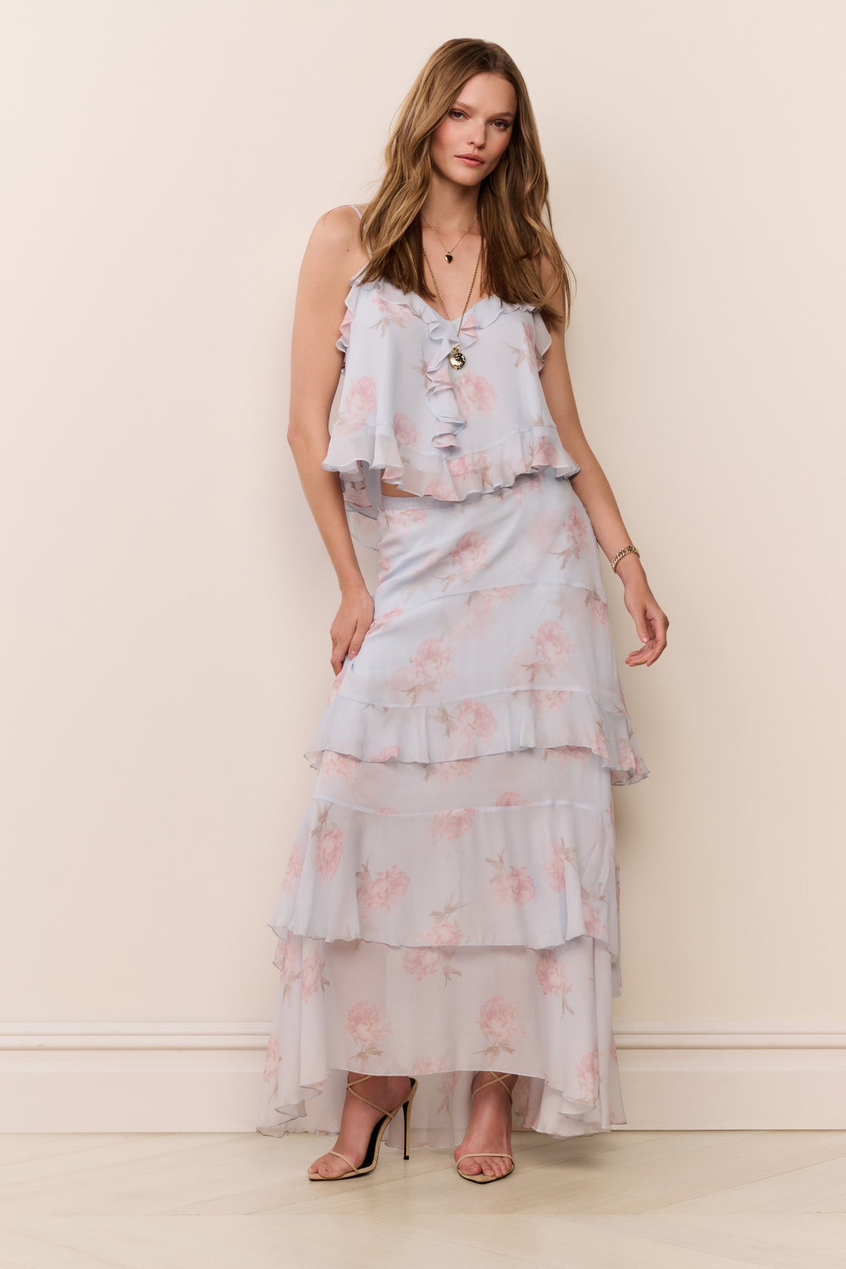 Light blue chiffon maxi skirt with pink floral print and cascading tiered ruffles