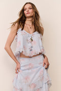 Light blue floral chiffon sleeveless top with cascading front ruffle trim