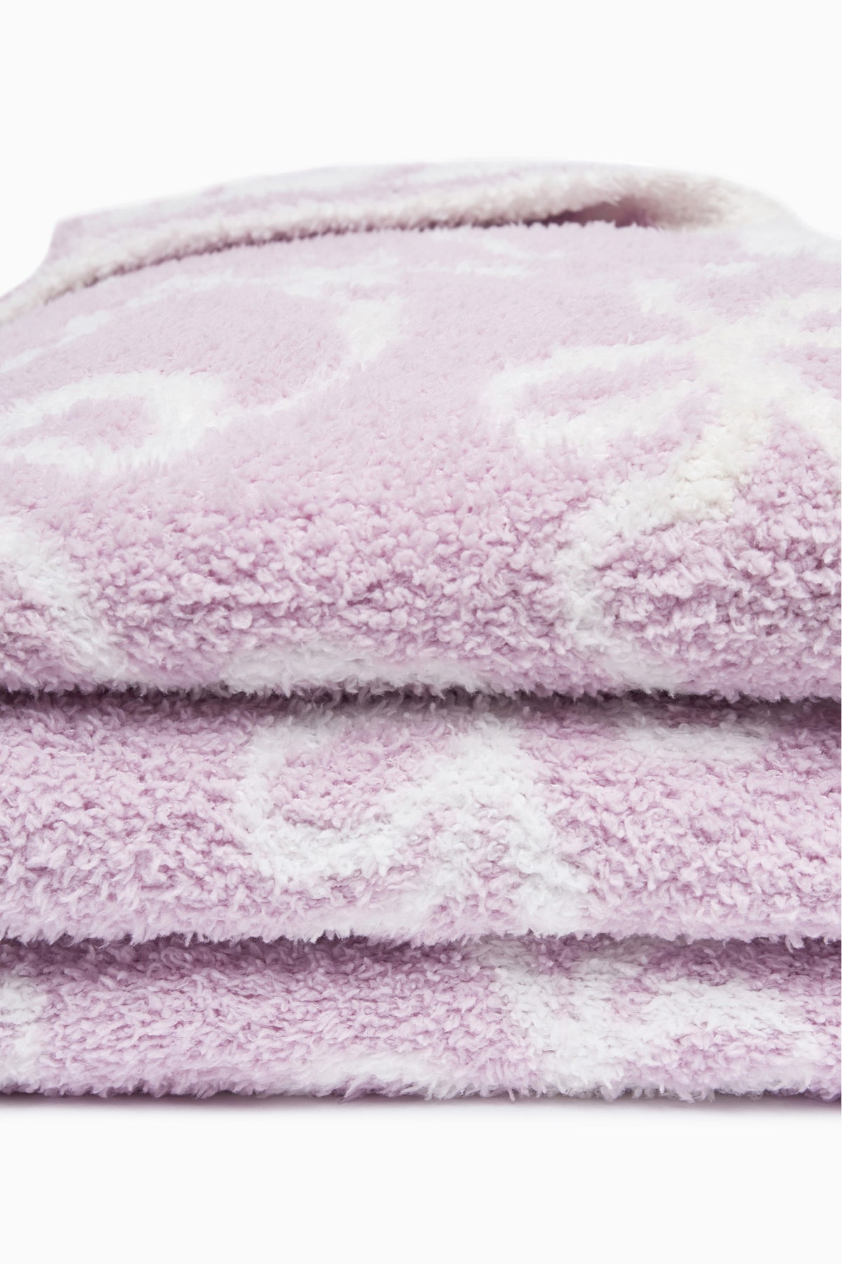 Light purple plush teddy bow blanket, close-up showing soft stacked pile