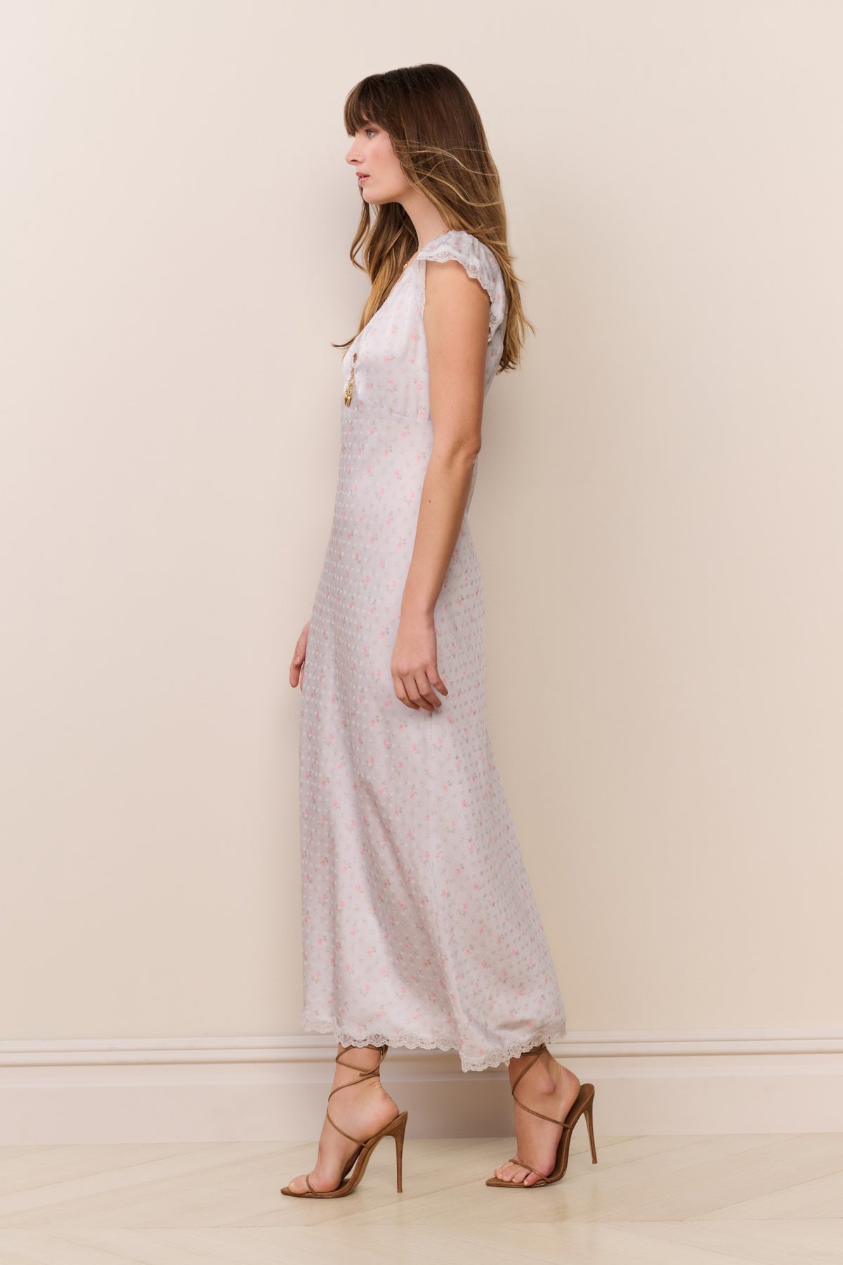 Light blue floral maxi dress with cap sleeves and lace-trim edge along hem