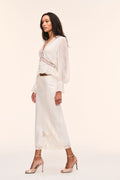 Silk lace blouse in pale stone with sheer sleeves, elastic cuffs, and lace-trim neckline