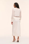 Silk lace blouse in pale stone, back view with sheer long sleeves and lace hem