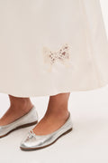 Ivory crepe maxi skirt hem with embroidered lace applique