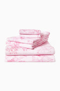 Cotton bath towel, pink and white floral print stack, folded neatly