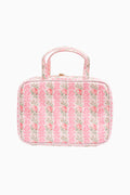 Pink floral print travel box with top handle and rounded front