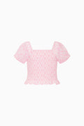 Pink short-sleeve top with lattice pattern and ruffled tiered hem