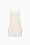 Ivory lace mini dress with thin spaghetti straps and scalloped hem
