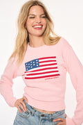 Blushing pink knit flag pullover with chest graphic and ribbed cuffs