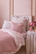 Rosewater euro pillow with embroidered lattice bows and layered ruffle trim