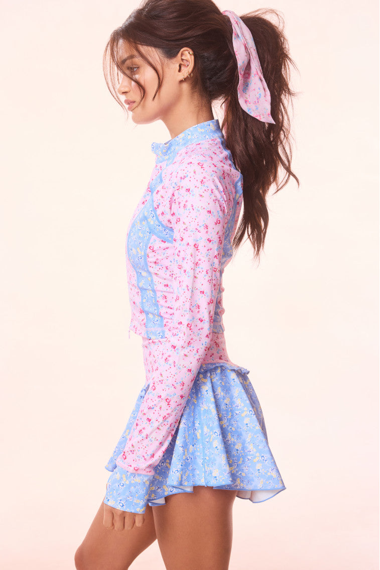 Floral active jacket back view, pink print with light-blue side panels