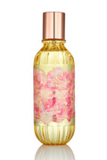 Hair and body perfume mist bottle with gold liquid, metallic cap, and floral label