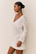 Cream crochet mini cover-up dress with V-neck and long sleeves, side view