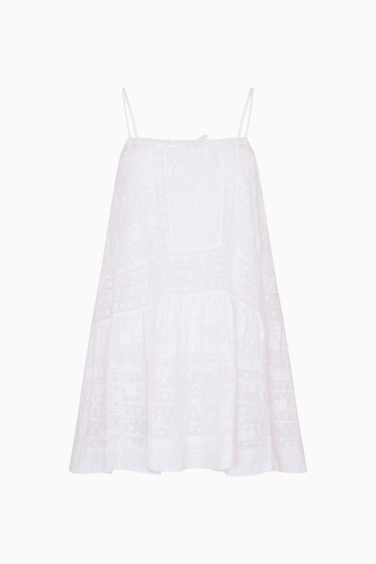 White cotton Victorian mini dress with spaghetti straps and tiered lace texture