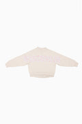 Cream mockneck crew sweatshirt with pink dotted graphic across the upper back