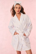 White floral cotton bath robe with tie belt, shawl collar, and long sleeves.