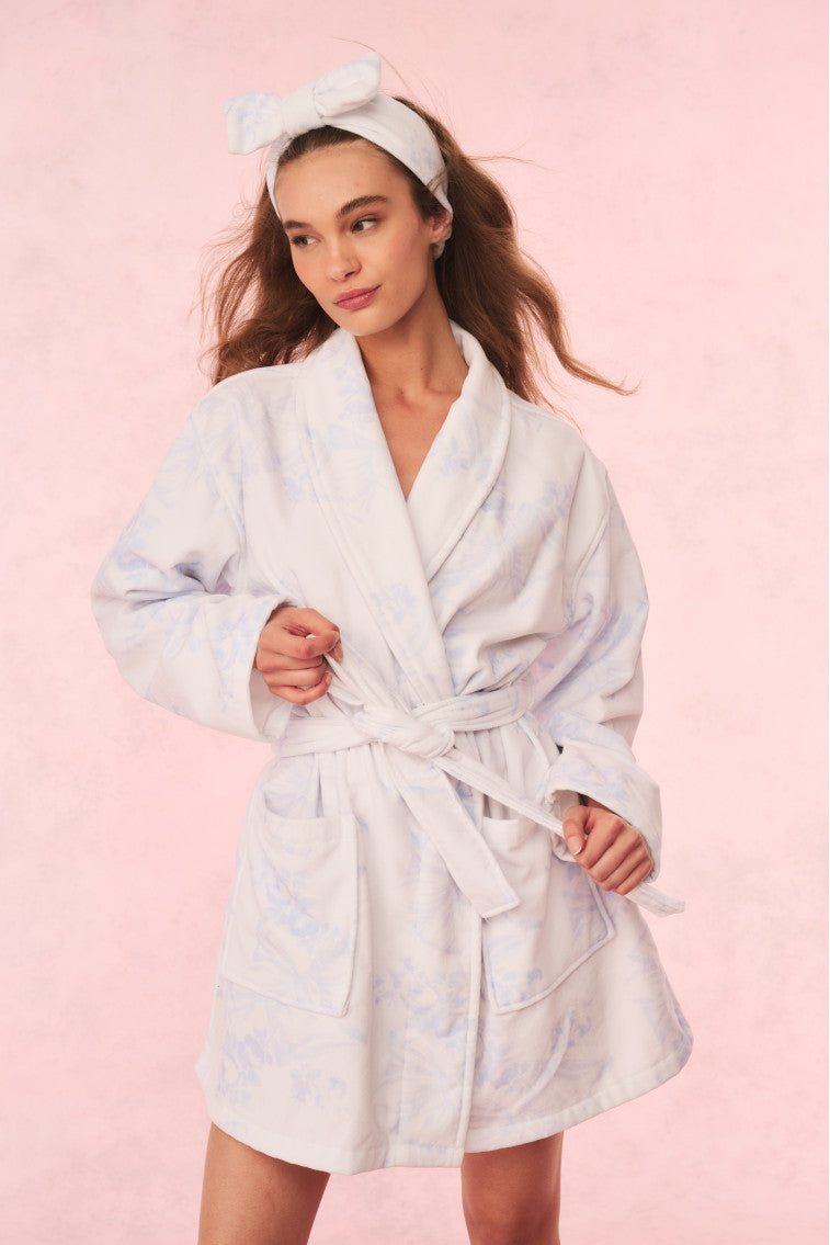 Light blue floral cotton bath robe with tie waist, shawl collar, and belt detail.