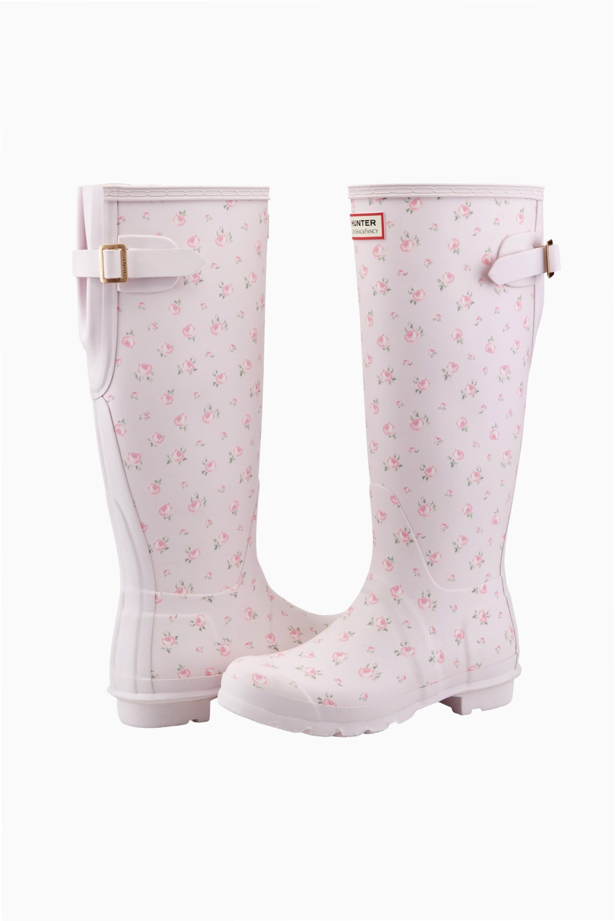Pair of white tall rain boots with pink floral print and buckle straps