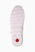 Light pink tall rain boot sole with textured tread and Hunter logo at heel