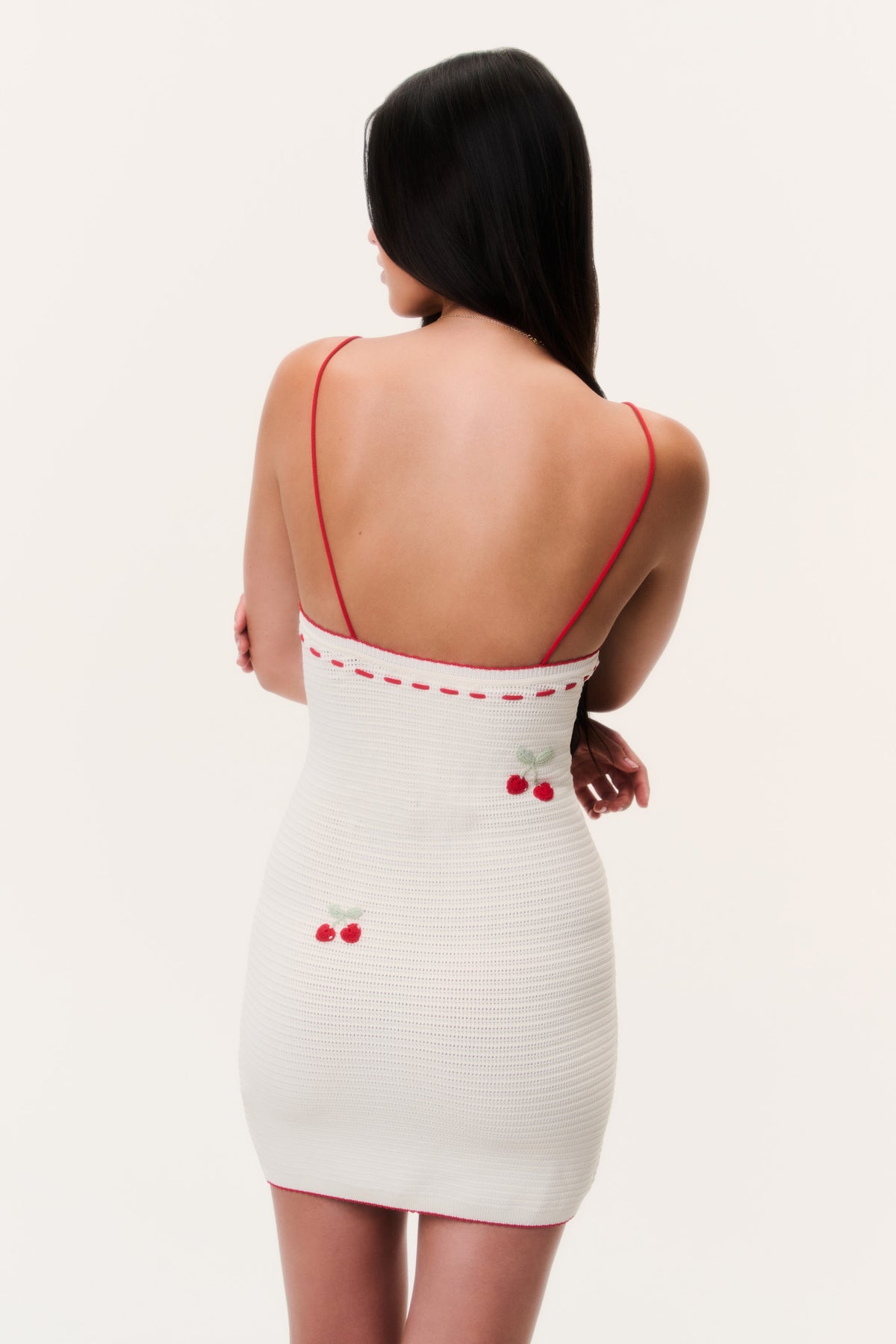 Back view crochet mini dress with red cherry embroidery and spaghetti straps