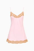 Light pink lace slip dress with V-neck, spaghetti straps, and scalloped hem trim