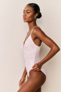Ivory one-piece swimsuit with pink toile print, thin straps, V-back