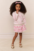 Girls pink heart print tiered ruffle mini skirt, front view