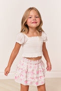 Girls cotton top in antique white with puff sleeves and smocked front.