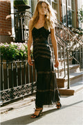 Black lace maxi dress with sleeveless straps and striped lace panels, full length