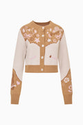 Wool-blend cardigan with button front, long sleeves, and teddy-and-star knit motifs