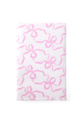 Pink cotton hand towel with bow-like pattern, close-up