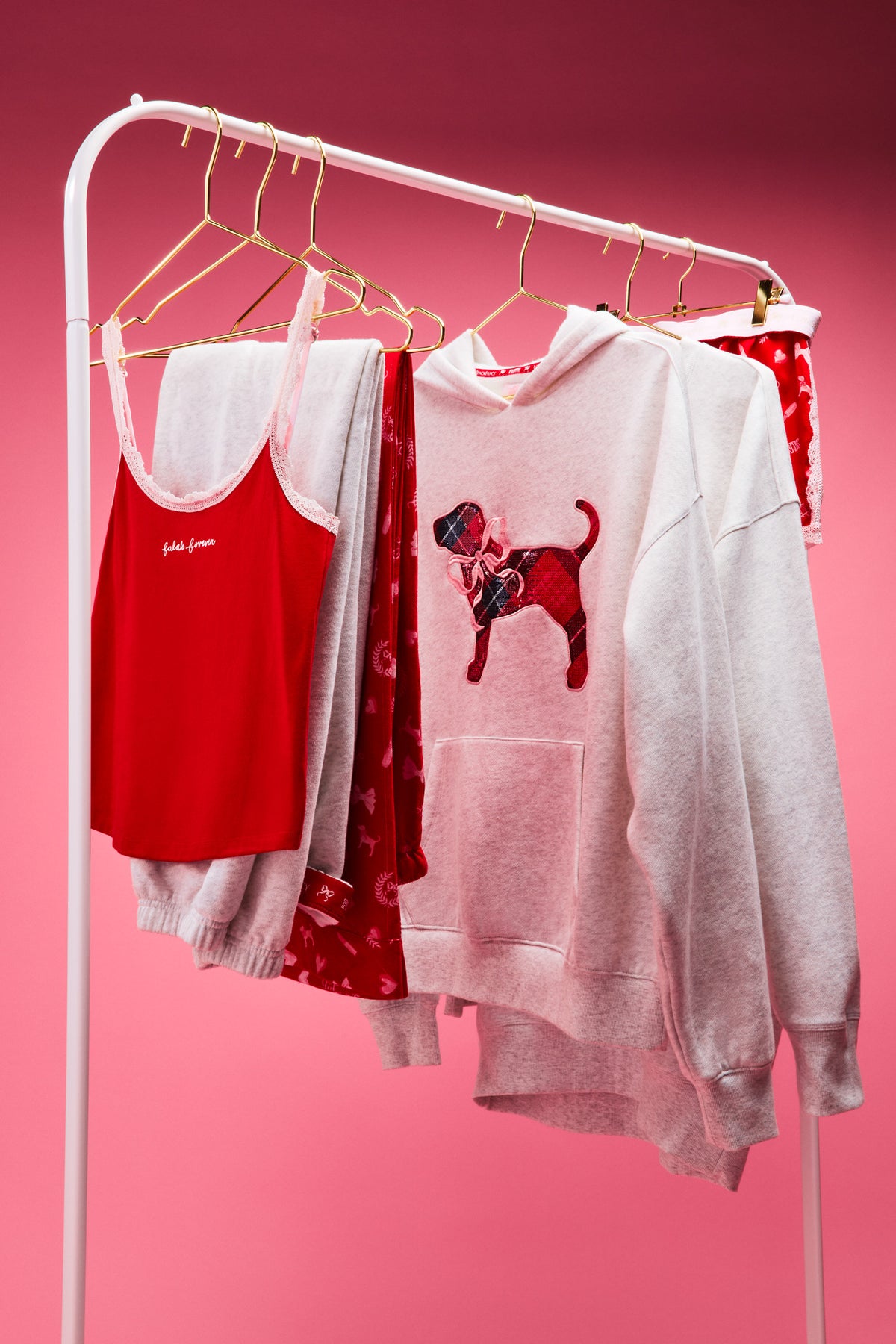 Cotton cami tanks on a rack, including red and light heather styles