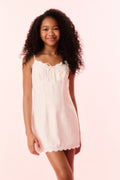 Girls off-white linen mini dress with drawstring bow front and scalloped hem