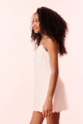 Girls off-white linen mini dress, sleeveless with scalloped hem