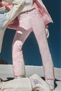 Close-up of light pink patterned ski pants with zipper fly and belt loops