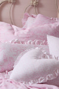 Heart-shaped ruffle pillows, light pink patterned fabric with frilled borders