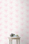 Peel-and-stick floral wallpaper in soft pink on a light background