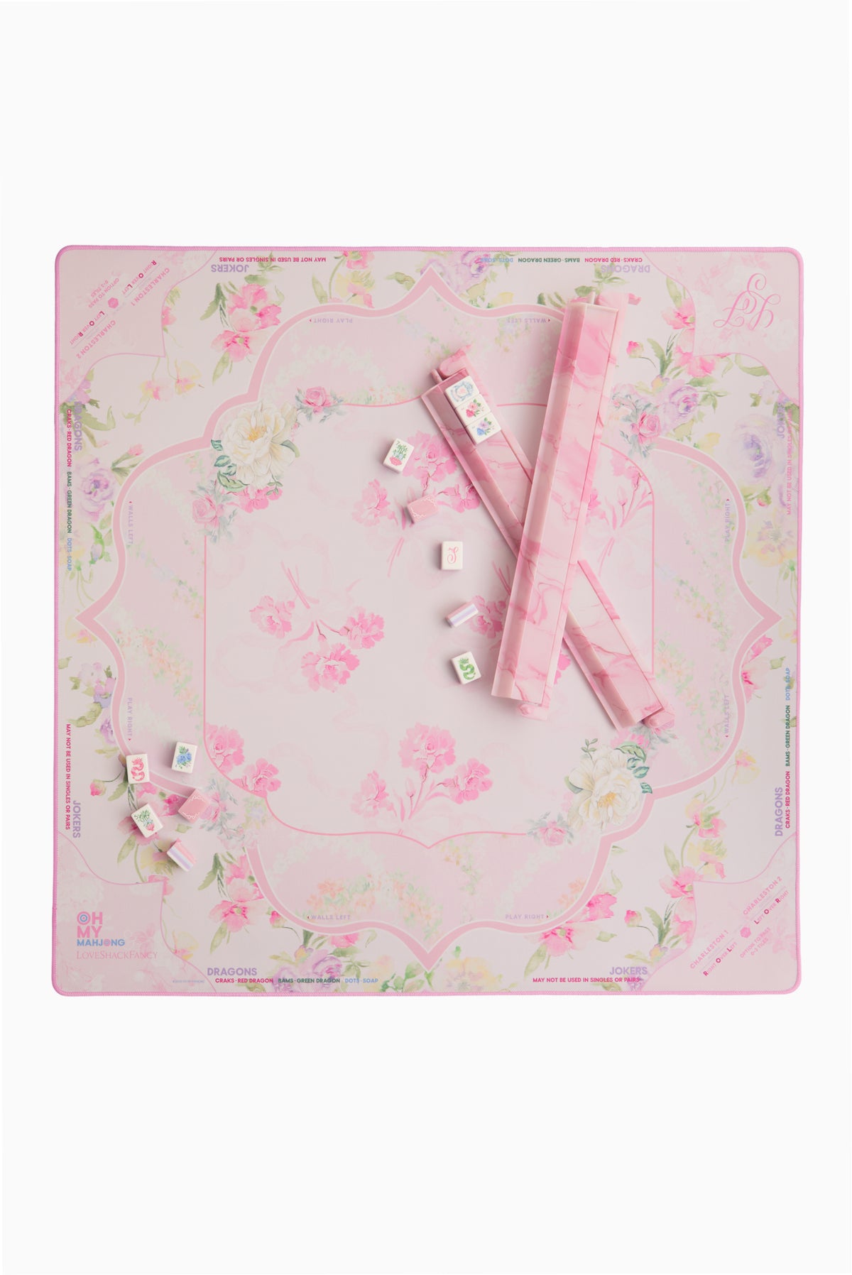 Mahjong mat with pastel floral pattern and scattered tiles