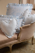 Heart-shaped ruffle pillow in pale blue with allover floral pattern