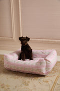Pink printed dog bed with cushioned bolstered sides