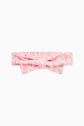 Pink bow face-wash headband with padded knot and gathered band