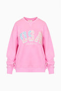 Pink fleece pullover with V-neck and glittery "USA" graphic logo on chest.