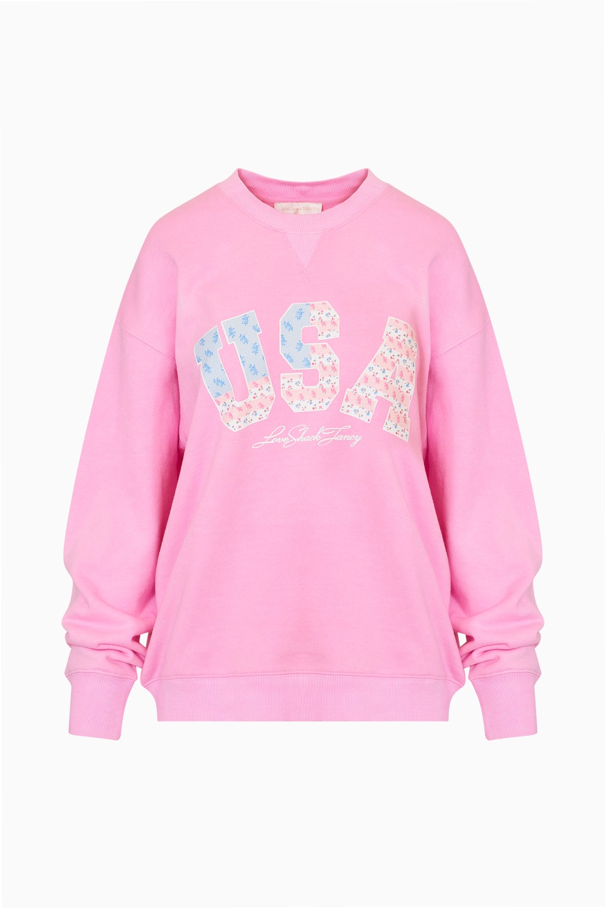 Pink fleece pullover with V-neck and glittery "USA" graphic logo on chest.