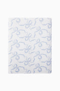 Cotton bath towel, light blue floral bow pattern, flat folded view.