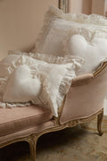 White ruffled euro pillow set with textured fabric and stitched square panels