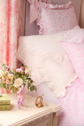 Pink mini accent pillow with heart shape and soft ruffled lace trim